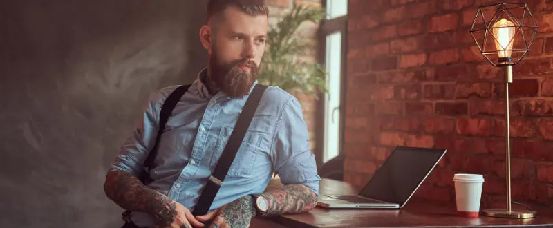 tattoo artist with laptop