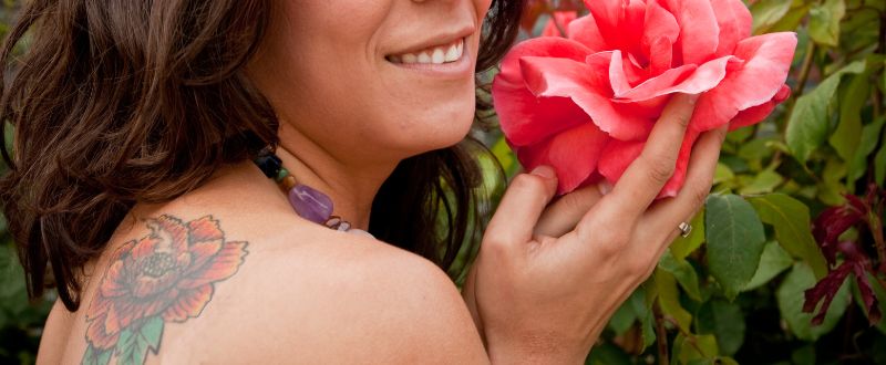 woman with a chrysanthemum  back tattoo