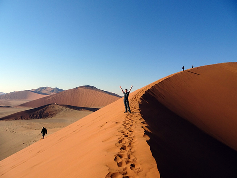 Climbing the sand dunes of Sossusvlei