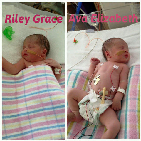 newborn twin girls side by side