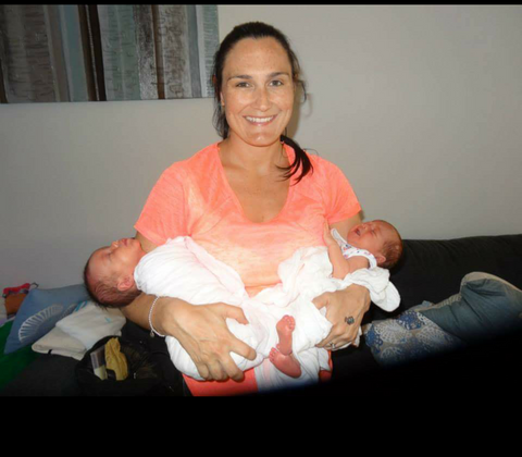 mum holding newborn twins