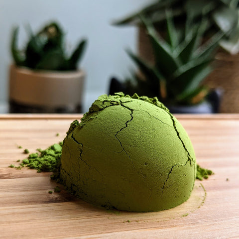 pile of green matcha on bamboo tray