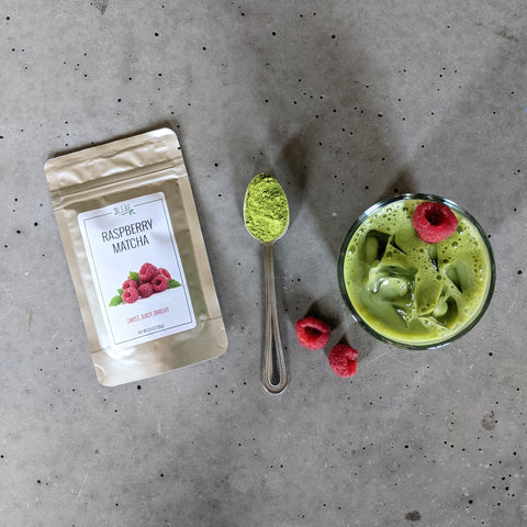 raspberry matcha bag on counter with iced raspberry matcha latte