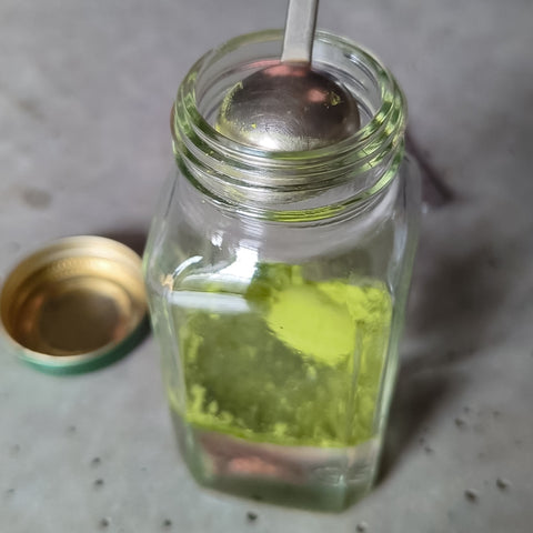 matcha added into a small glass container