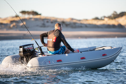 Photo of a True Kit Discovery at speed.  The longer the boat the faster the performance