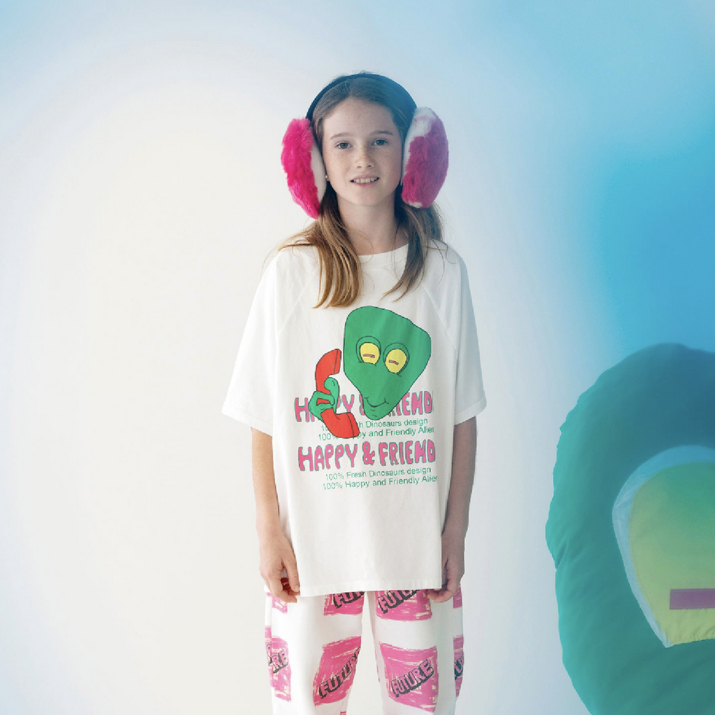 Young girl in Fresh Dinosaurs Alien Oversize T-Shirt and Future Pants at Design Life Kids.