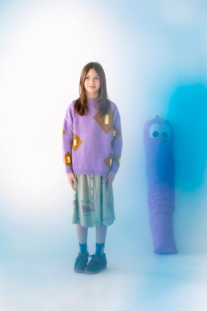 Young girl in Fresh Dinosaurs Purple Meteorito Jumper at Design Life Kids.
