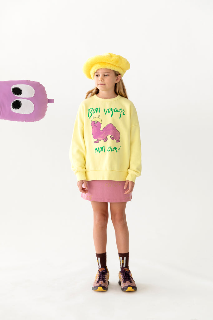 Young girl in Fresh Dinosaurs Gusano Sweatshirt at Design Life Kids.
