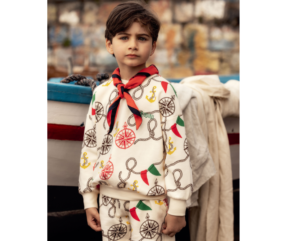 Young boy in Mini Rodini Nautical AOP Sweatshirt at Design Life Kids
