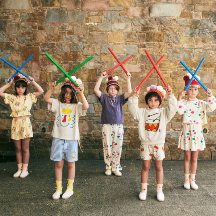 Young children styling Bobo Choses SS24 Outfits holding drumsticks at Design Life Kids