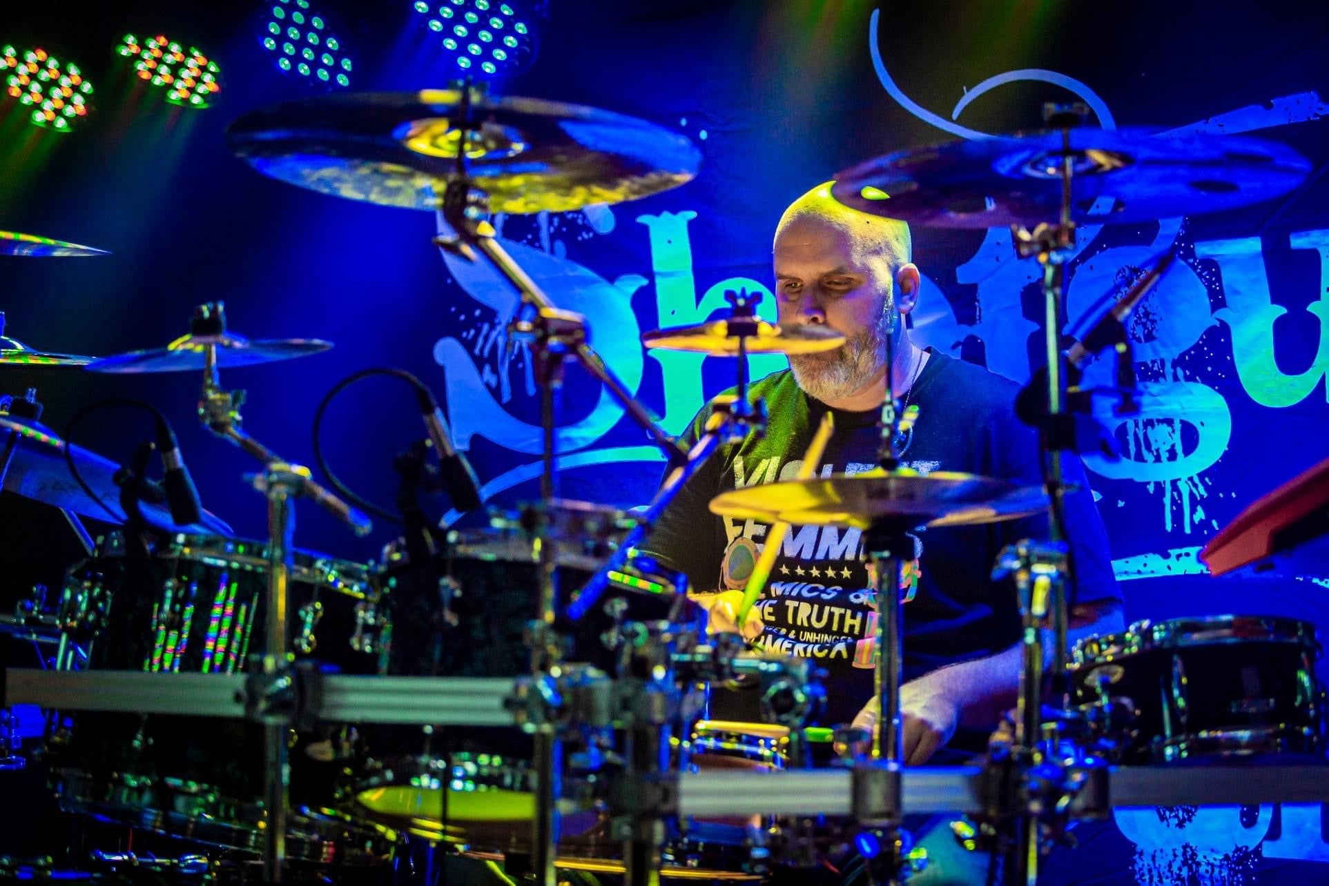 Drummer Chris Sodemann poses with Scorpion Percussion drumsticks behind his drumkit