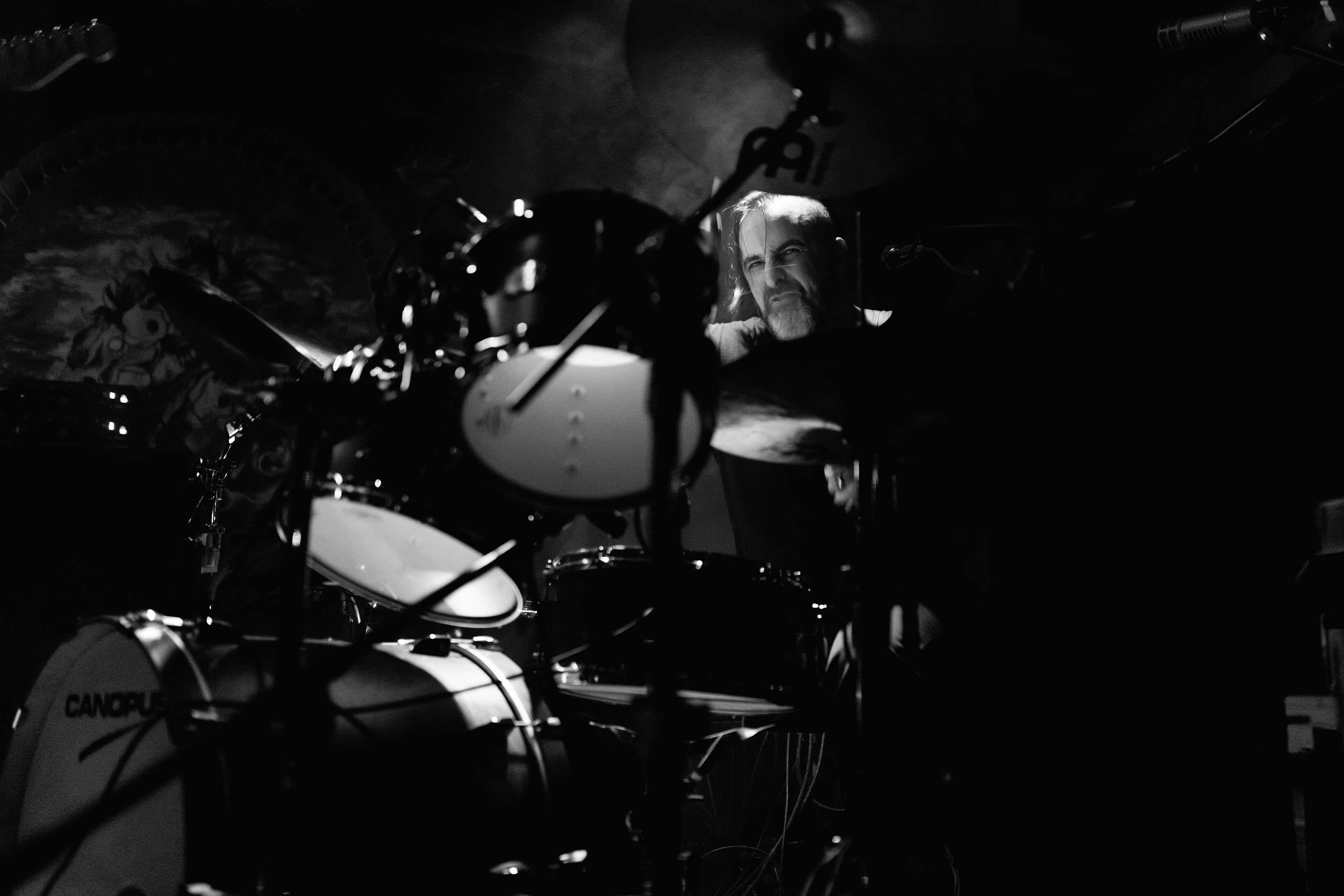 Drummer Nick Gaffaney poses with Scorpion Percussion drumsticks behind his drumkit