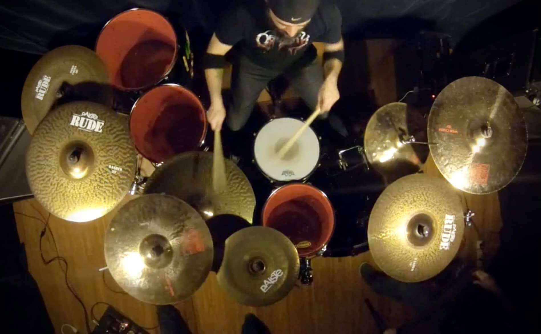 Drummer Robb Birkbeck poses with Scorpion Percussion drumsticks behind his drumkit