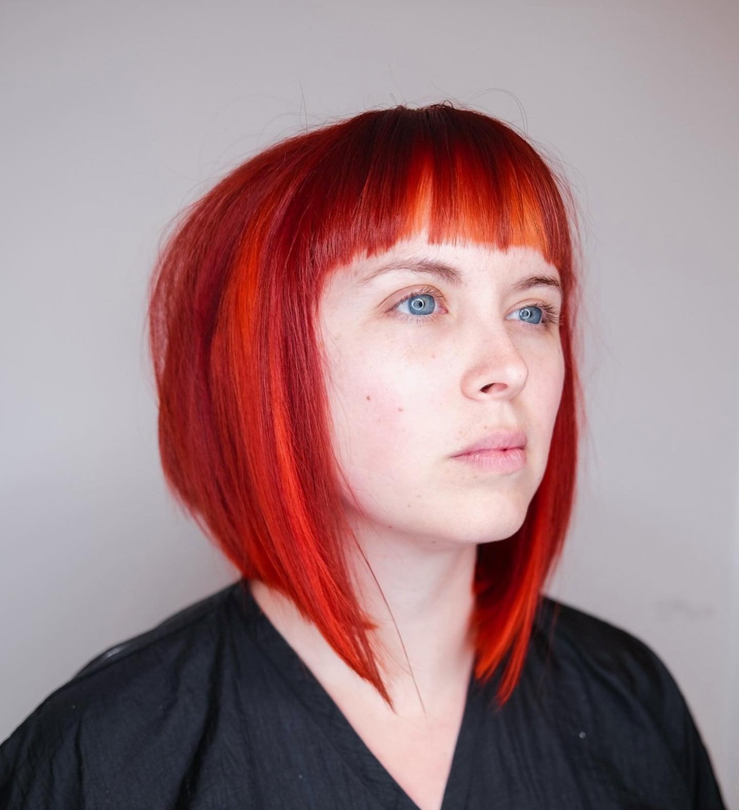 1. Vibrant Cherry Red Bob with Micro Bangs - Asymmetrical Bob Hairstyles