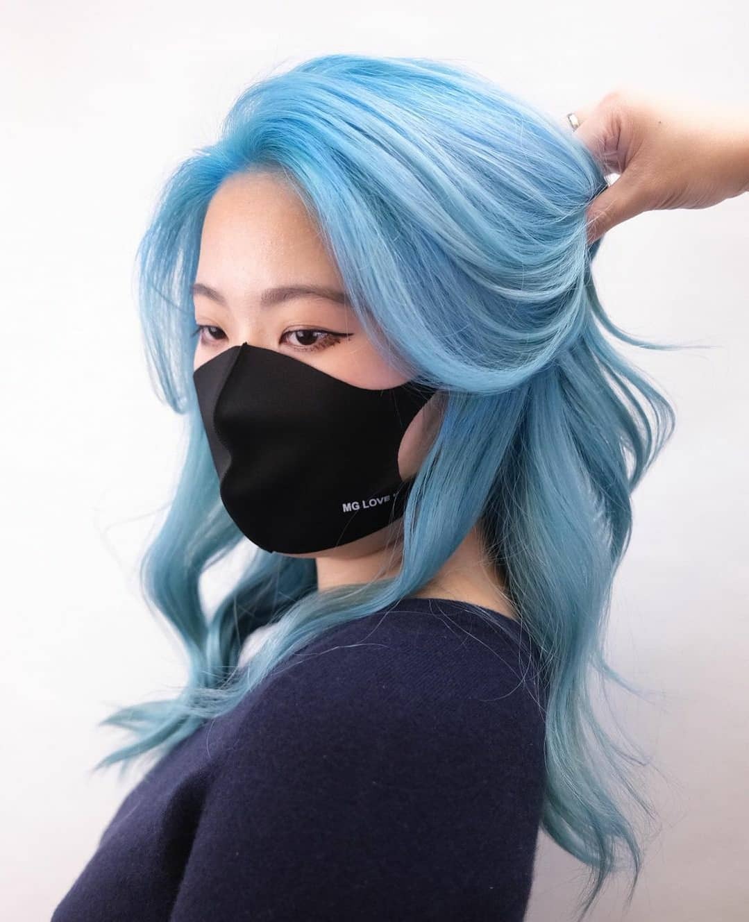 11. Sky Blue Blowout with Feathered Volume - Blue hair color