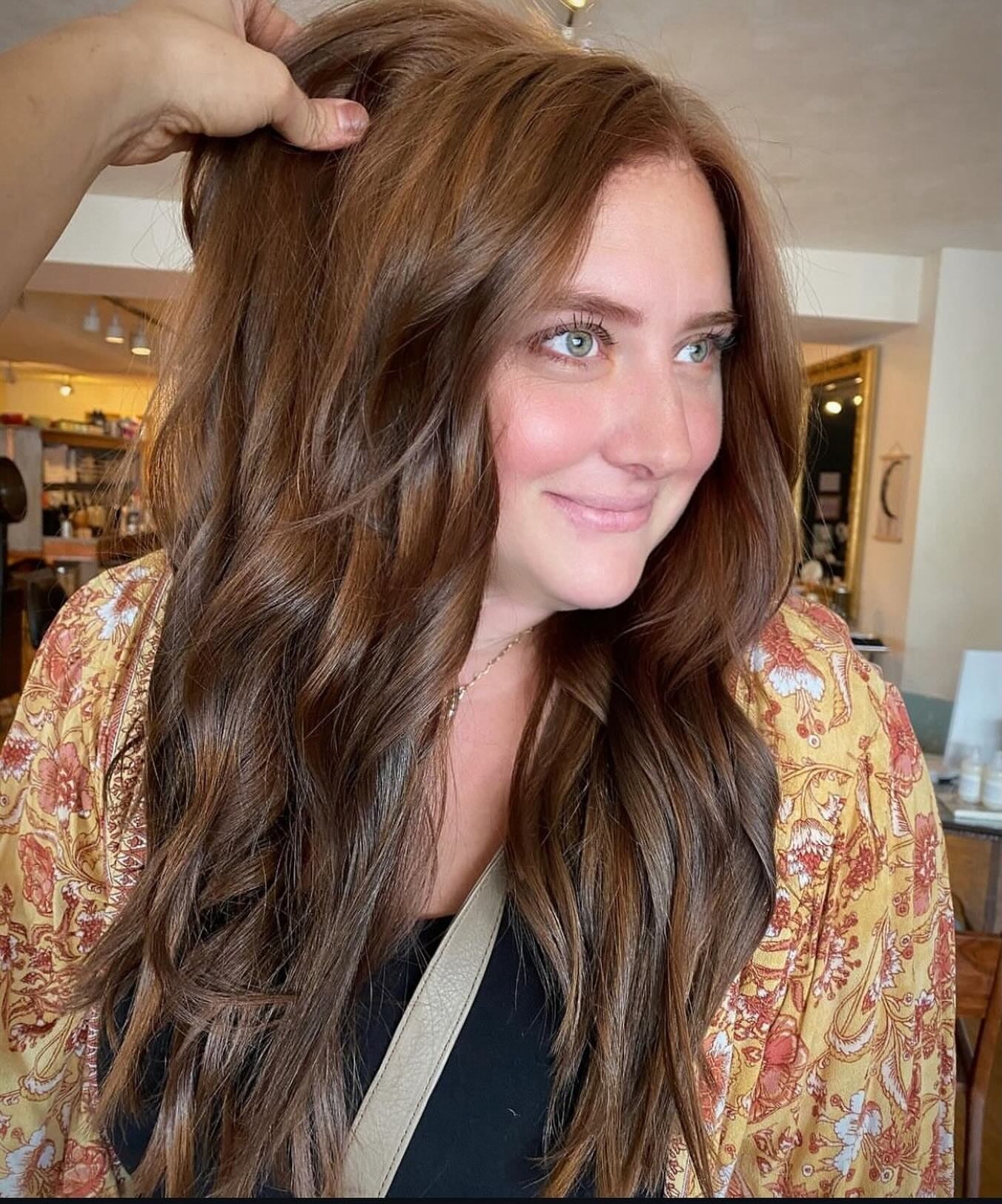 13. Glossy Chestnut Waves with Auburn Blend - Golden Brown Hair Color