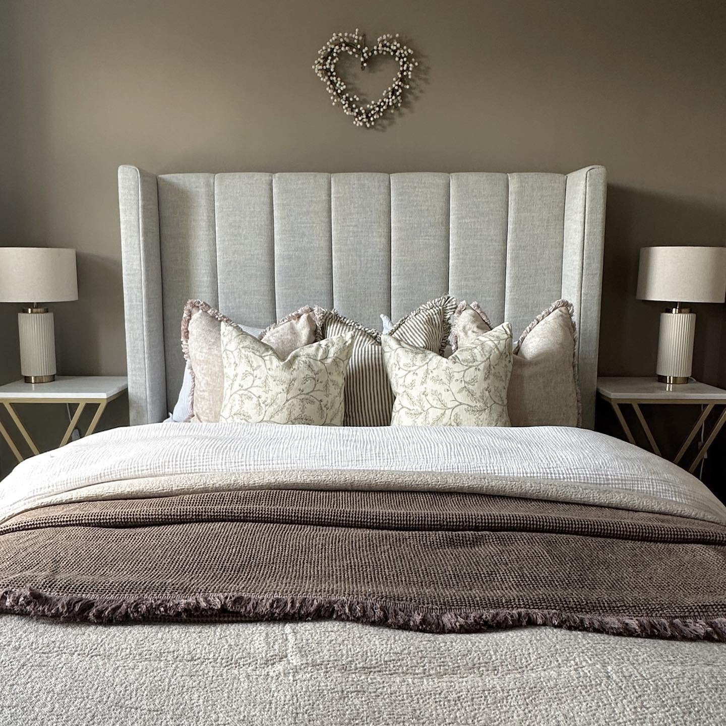 16. Muted Taupe and Gray with Luxurious Wingback Texture - Earthy Bedroom Ideas