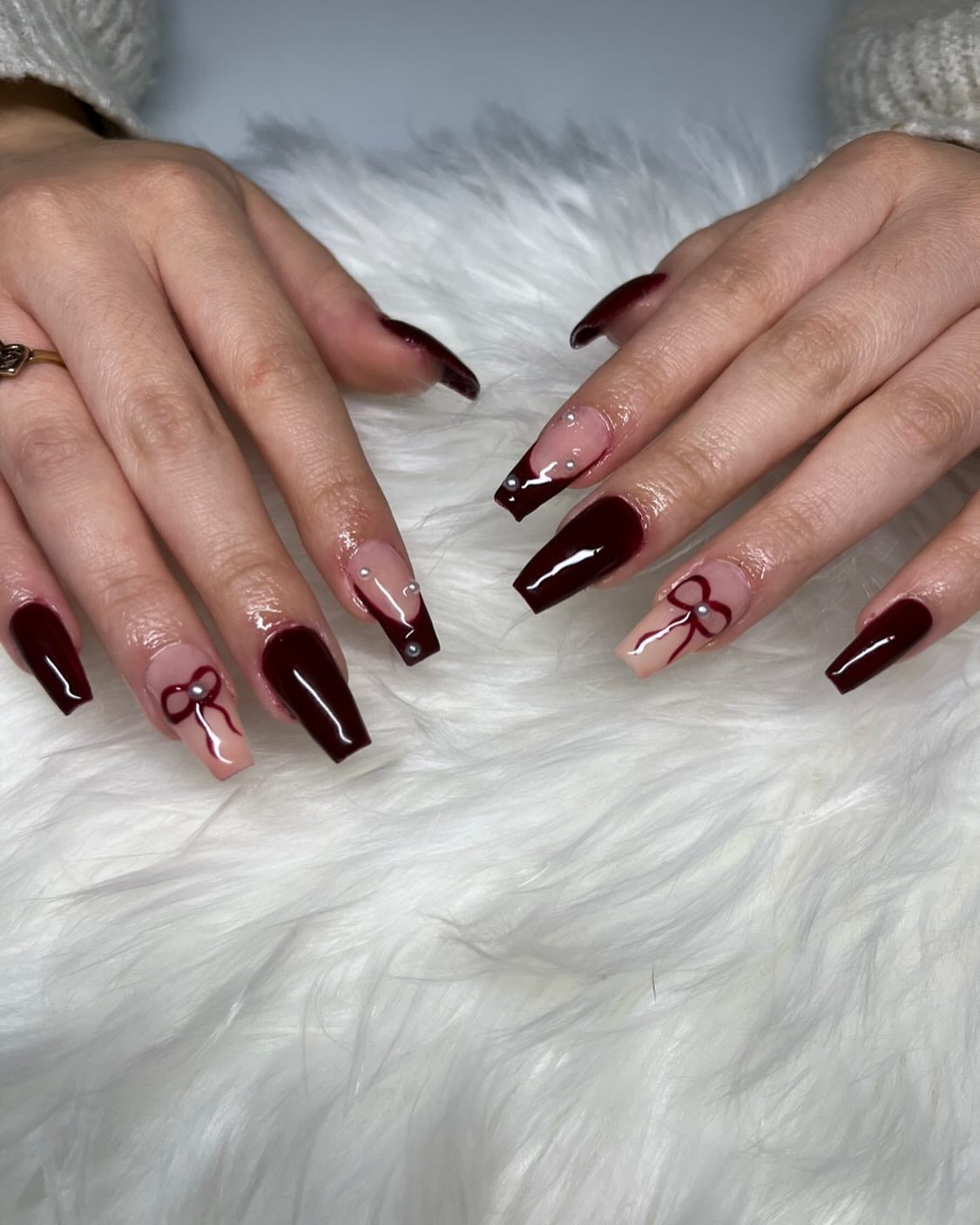 2. Cherry Mocha Coffin Nails with Bow Accents - Dark Red Coffin Nail Ideas