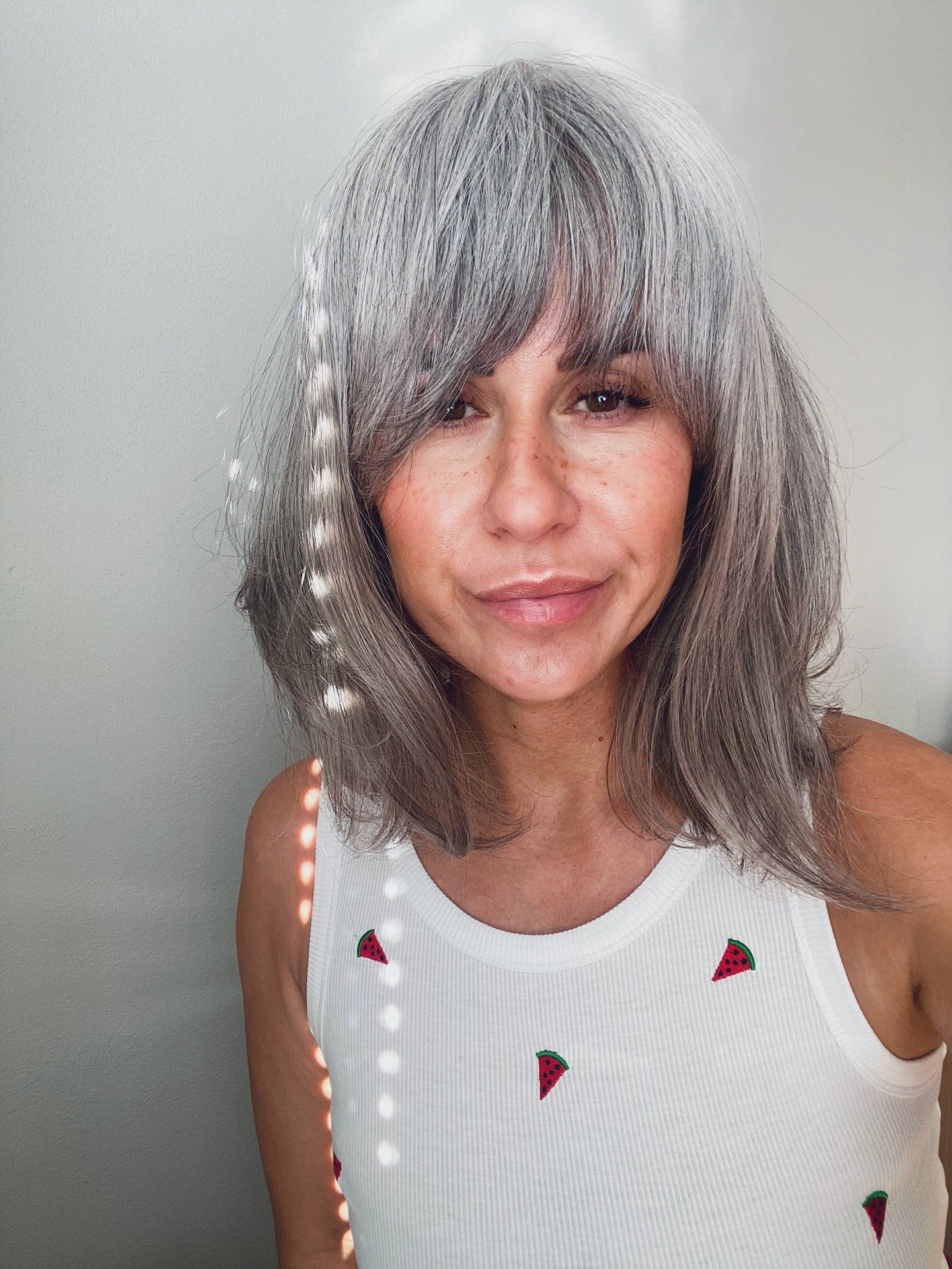 2. Textured Silver Bob with Bangs - Silver Hair Color