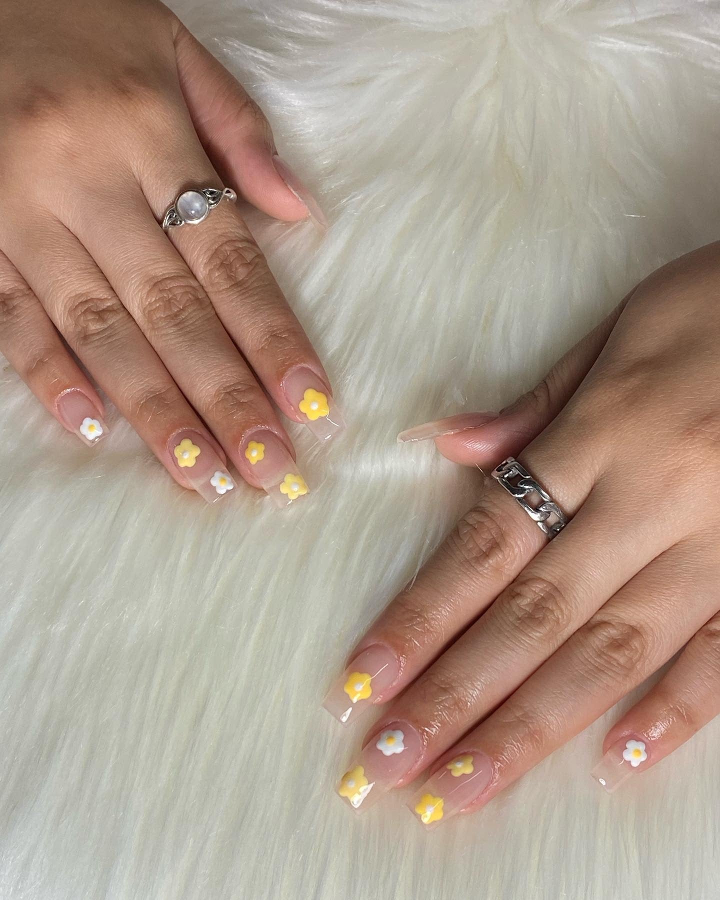 9. Cute Floral Tips on Clear Base Nails - Yellow and White Nail Ideas