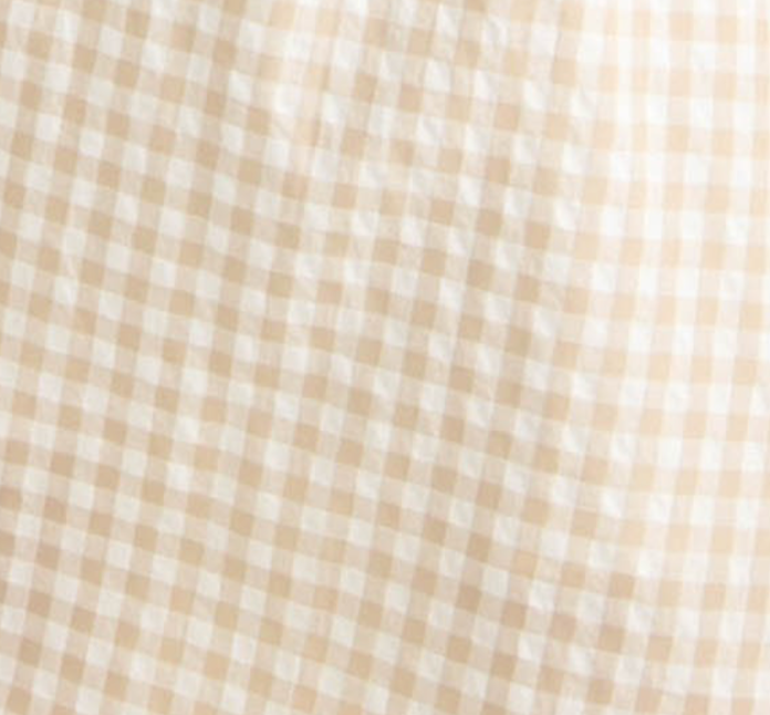 Midi dress in a beige gingham print with cutout details.