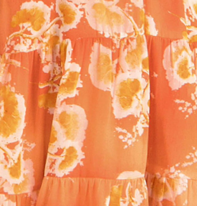 Mini dress in an orange floral print with cutout details.