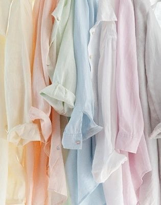 Shirts hanging in pastel colours