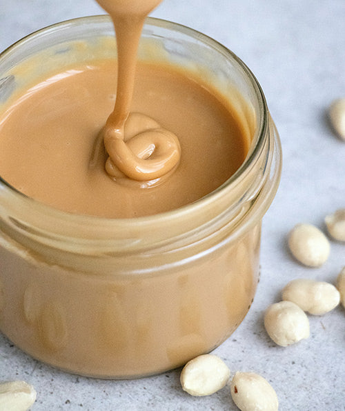 Clear glass jar with peanut butter