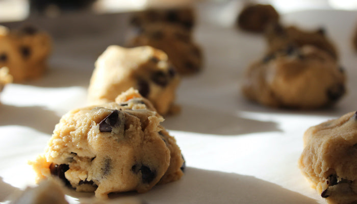 Round chocolate cookies on white surface