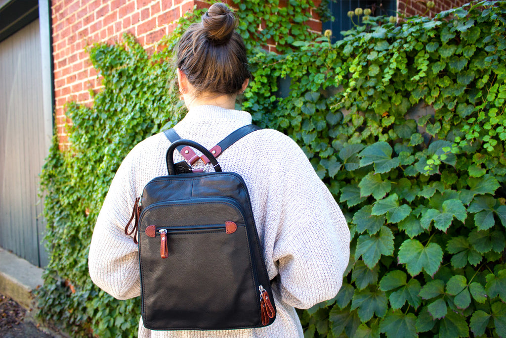 RFID backpack with sweater and ivy brick wall