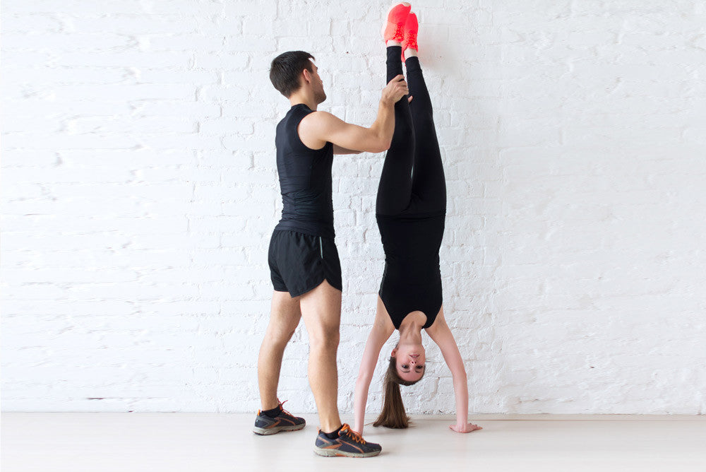 Girl practicing gymnastic pose on pad, side view, Stock Photo, Picture And  Royalty Free Image. Pic. IGM-19774034 | agefotostock