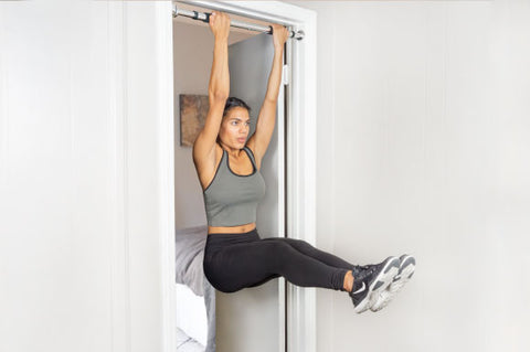 Woman doing pull-ups on a multi-grip pull-up bar