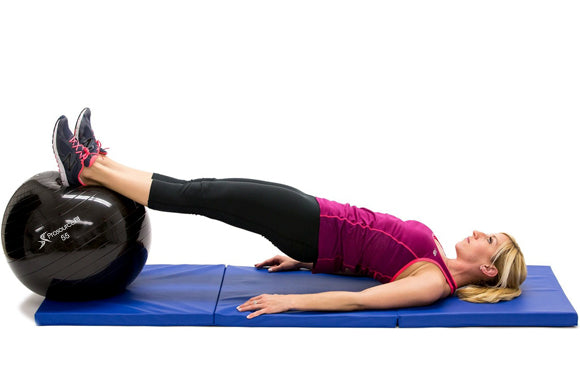 woman in starting position of hamstring curl on prosourcefit stability ball