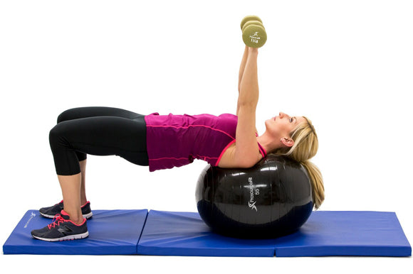 woman performing dumbbell chest press on prosourcefit stability ball