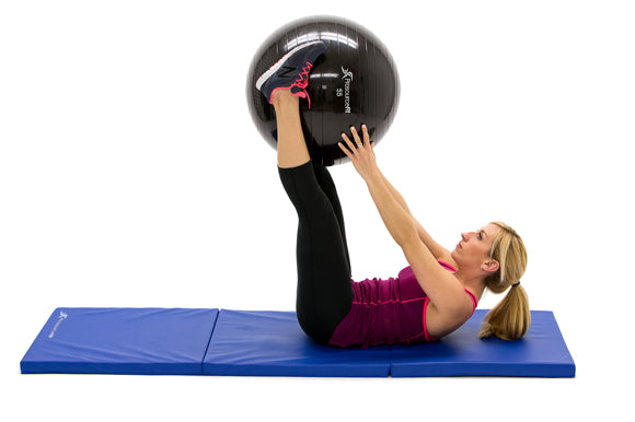 woman passing prosourcefit stability ball from feet to hands