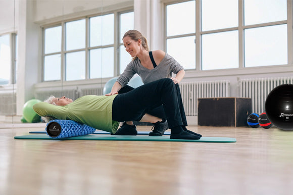 elderly woman stretching upper back with prosourcefit foam roller