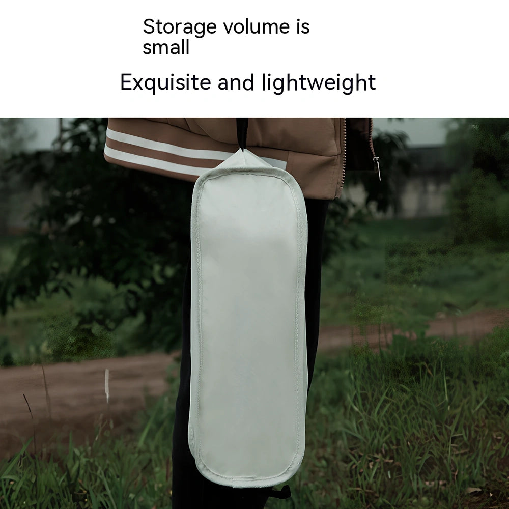 Outdoor folding chair with 600D Oxford cloth in ivory white, shown in folded position with storage bag