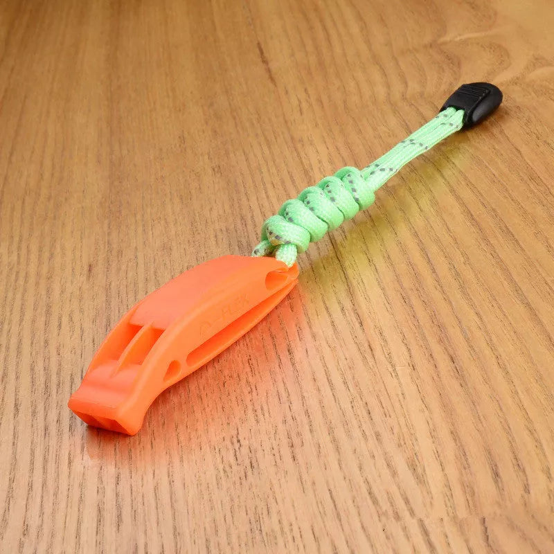 Fire survival whistle with dual-frequency sound emission