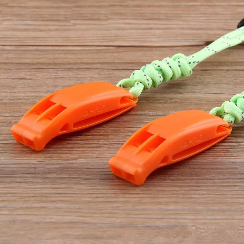 Fire survival whistle with dual-frequency sound emission