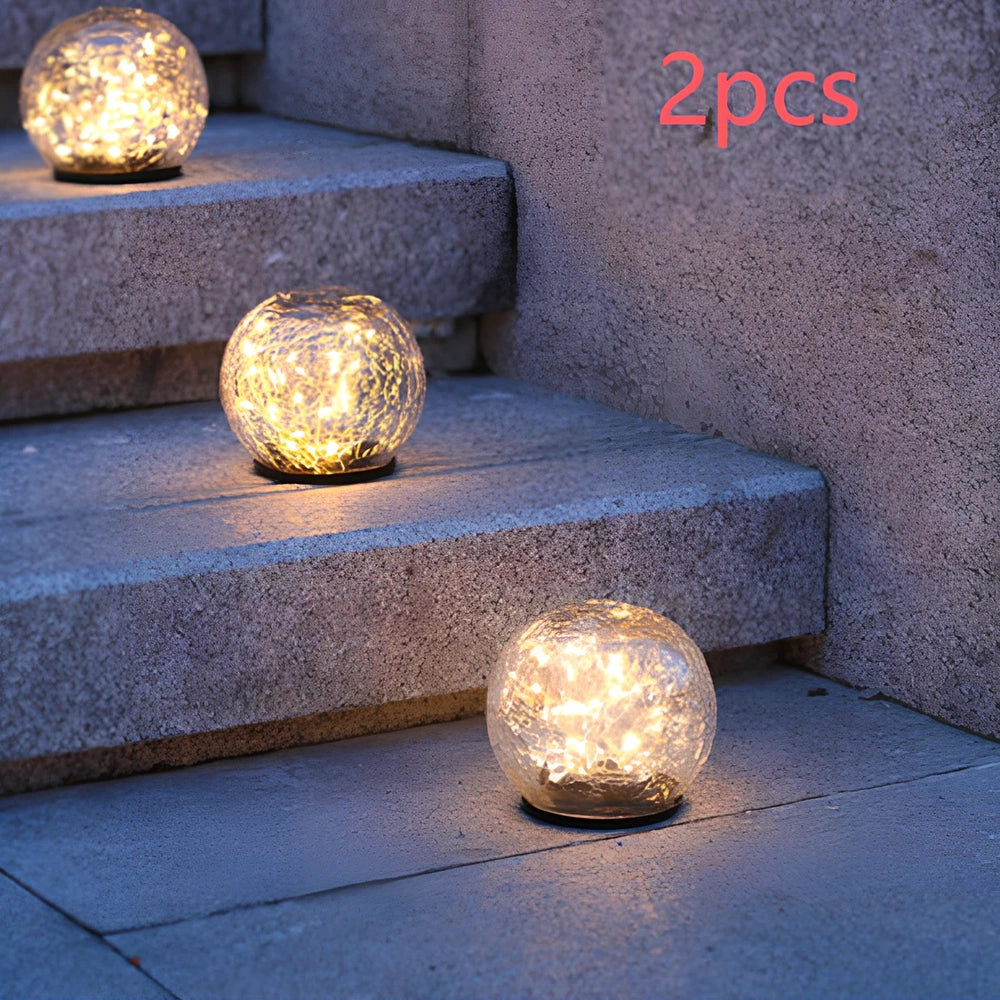 Cracked glass ball LED solar light, 10cm size with warm white glow for garden paths, waterproof and ground stake included