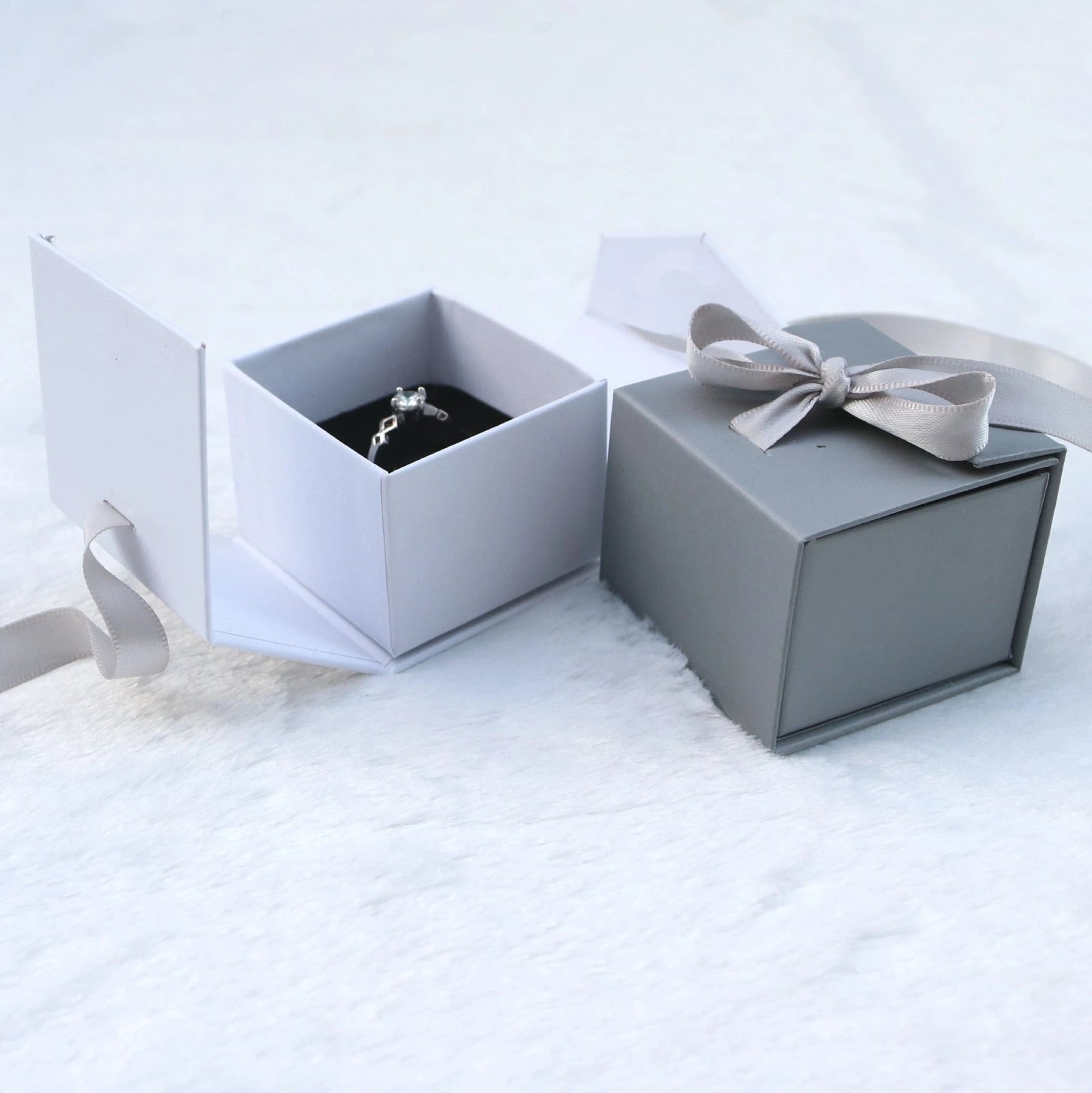 Square grey jewellery gift box with ribbon bow measuring 5x5cm for ring and earring storage
