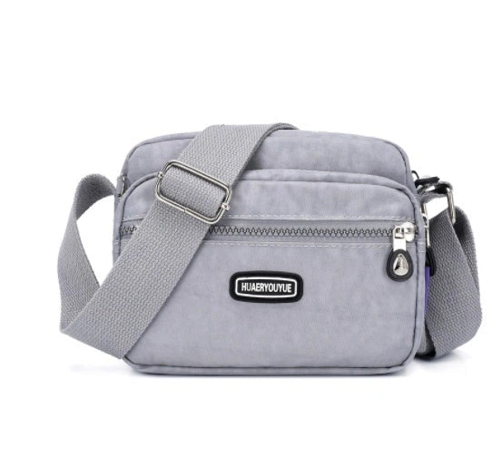 Compact Nylon Messenger Bag with Multiple Compartments