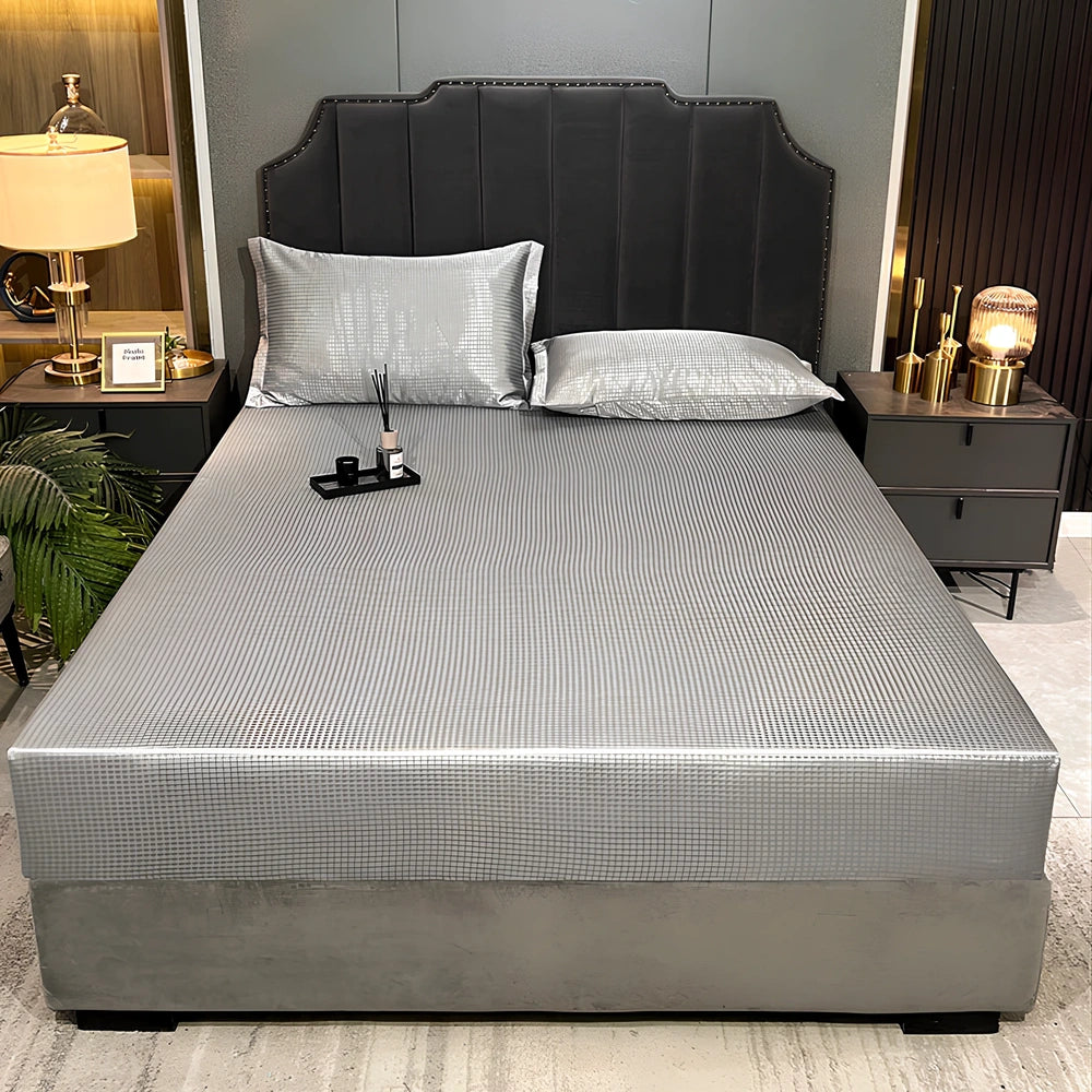 Houndstooth ice silk jacquard fitted three-piece bedding set in ice blue, 180x200cm size with pillowcases on white bed