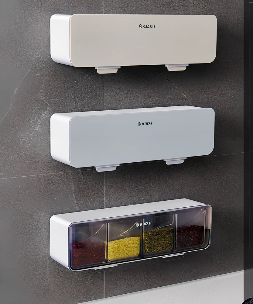 Wall-mounted plastic spice box set with multiple compartments and measuring spoon in kitchen