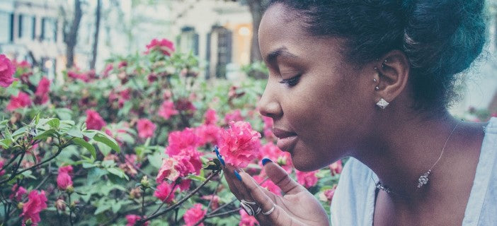 smelling flowers