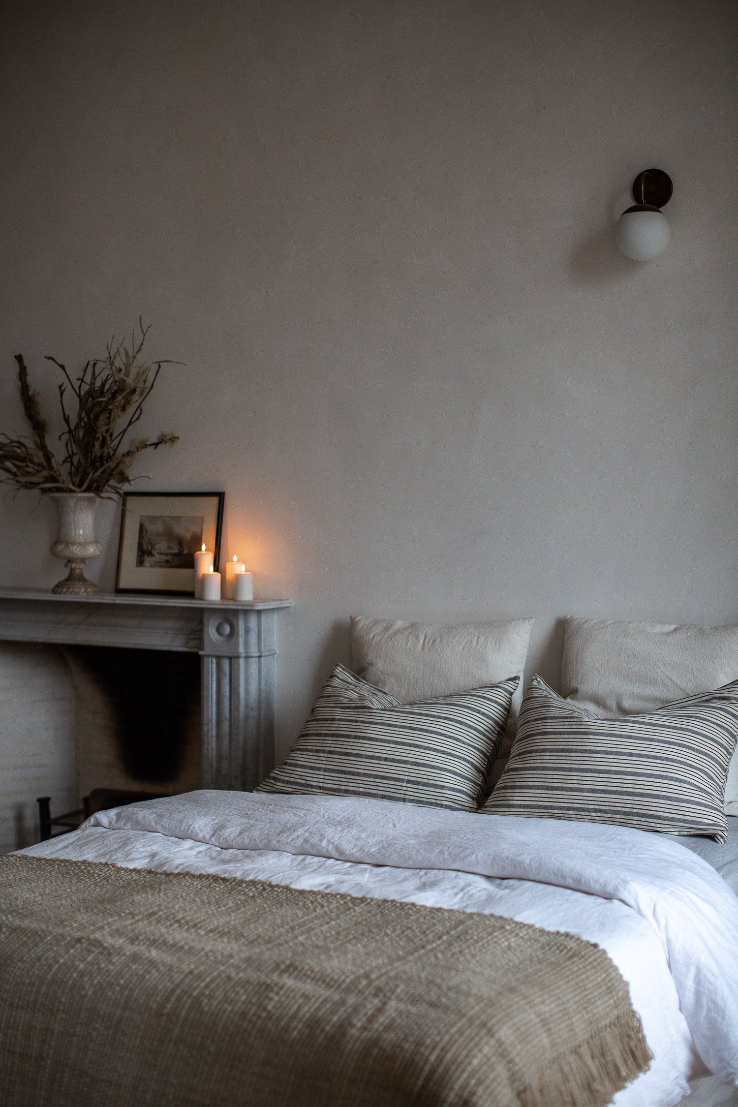 natural bedroom decor with linen and wool