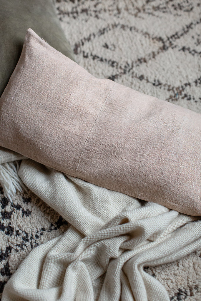 vintage hand dyed linen cushion cover in soft pastel pale pink 