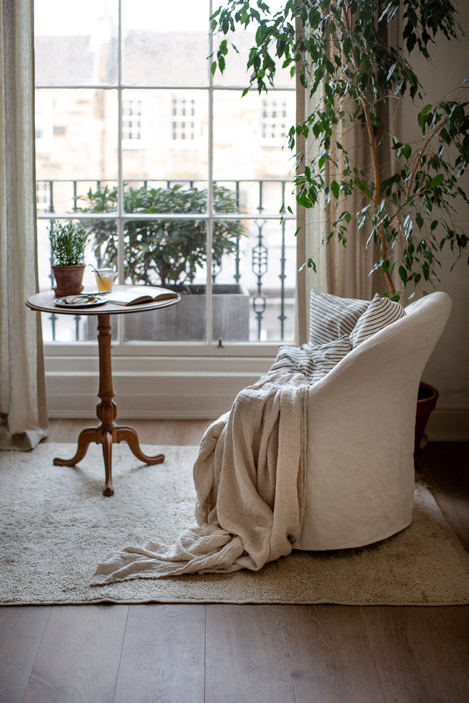 natural home decor with linen and plants 