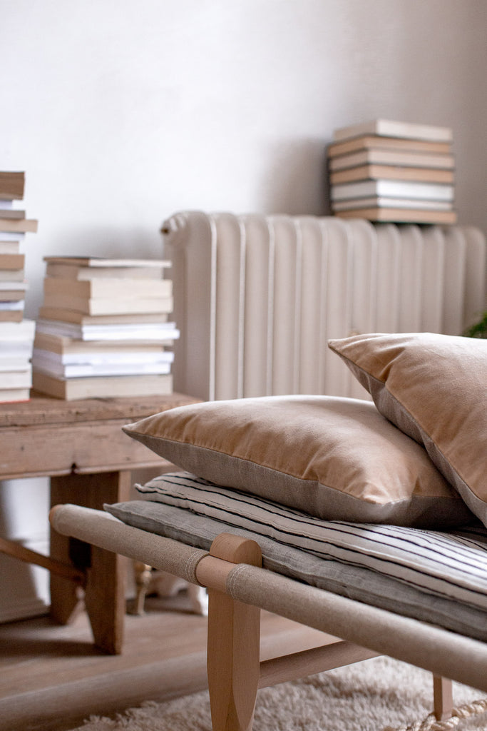 daybed and stack of books