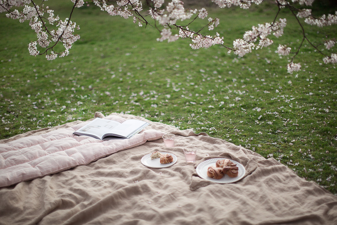 cherry blossom picnic with linen blanket 